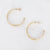 Gouden stainless steel oorringen met dubbel gedraaid design en glanzende afwerking.