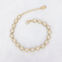 Goudkleurige armband met ronde zirconia steentjes en verstelbare verlengketting