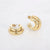 Gouden stainless steel oorringen met dubbele band en glanzende afwerking.