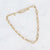 Gouden stainless steel schakelketting met ovale schakels en verstelbare lengte.