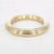 Gouden stainless steel bangle met gelaagd, geribd design en glanzende afwerking.