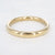 Gouden stainless steel bangle met gladde, glanzende afwerking in smalle uitvoering.