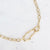 Gouden stainless steel schakelketting met organische dubbele schakel in het midden.