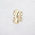 Gouden stainless steel ring met organische open vorm en geborstelde matte afwerking.